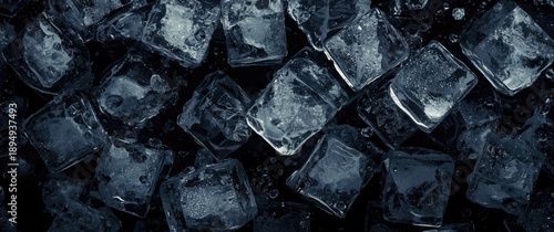 Ice water in dark and bright tones with stunning ice cubes set against a black background, emphasizing clear textures and artistic design, illustrating the purity of ice cubes and the coolness of