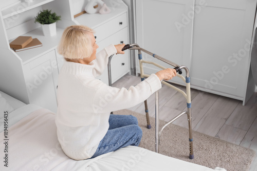 Senior woman with walker ge...