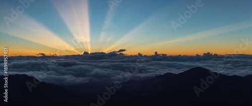 Wallpaper Mural North Island, New Zealand: Sunrise over Ruahine Ranges with clouds illuminated and a blue-orange sky gradient Torontodigital.ca