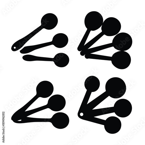 Black silhouettes of various measuring spoons, essential tools for culinary and kitchen design