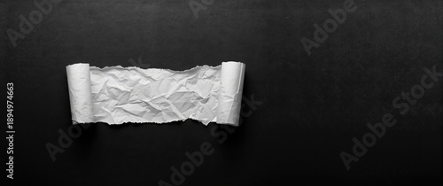 Torn white paper pieces aga...