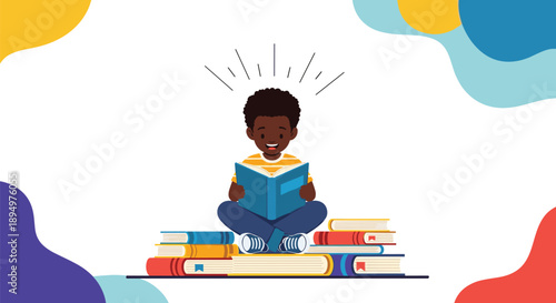 Cheerful young boy sits cross legged on a large pile of colorful books and enjoys reading with sparks of imagination.