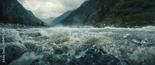 Panel kuchenny z motywem Flood water in mountain river tributary under high pressure caused by melting glaciers, torrential rains, and global warming, with selective focus and depth of field