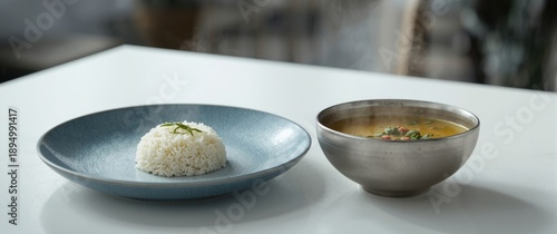 Plate of rice and soup disp...
