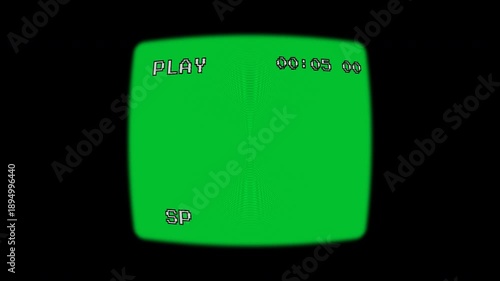 A vintage VHS viewfinder overlay features a chroma green screen center, framed by a black vignette with realistic scanlines, 