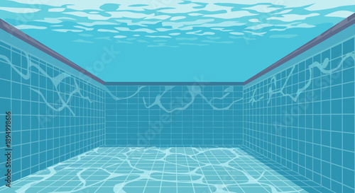 Underwater view of an empty swimming pool with tiled walls and rippling water surface