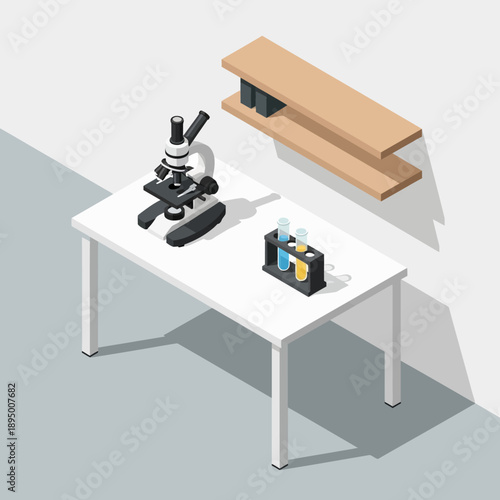 Microscope and laboratory equipment on a white table.