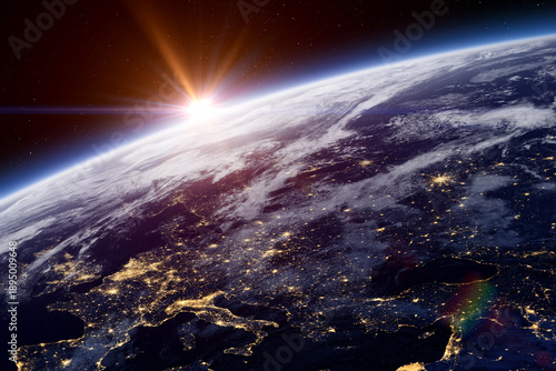 Earth. Sunset over planet Earth. Europe at night view from space. Earth planet with a blue atmosphere and space background. Space high resolution background.