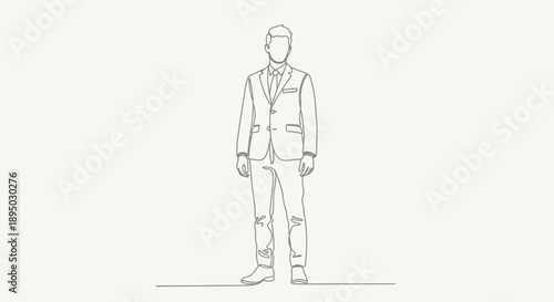 Man in a suit standing confidently.