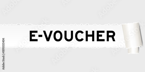 Ripped gray paper background that have word e-voucher under torn part