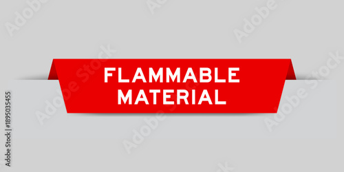 Red color inserted label with word flammable material on gray background