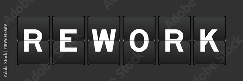 Black color analog flip board with word rework on gray background