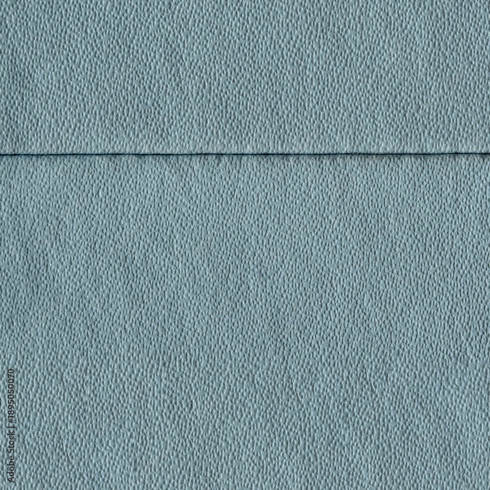 Fototapeta premium Light blue textured wall surface with subtle horizontal seam