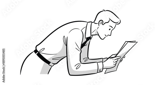 Businessman leaning forward reading document closely in office