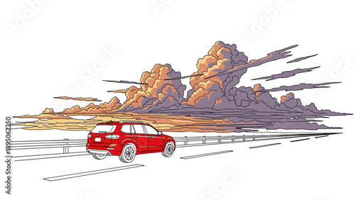 Vibrant red car driving on highway at sunset with dramatic cloudscape