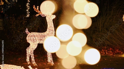 Christmas deer made of glowing garlands. Shining installation of garlands.
