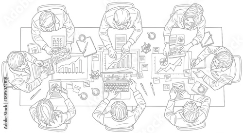 Business team meeting around a table with laptops and documents planning strategy