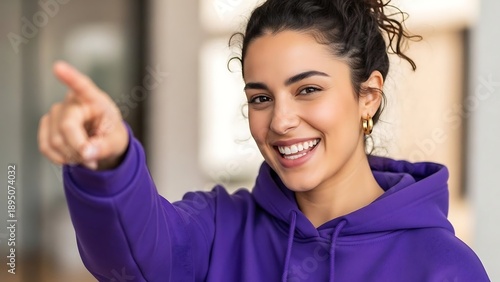 Wallpaper Mural Young woman pointing and smiling directly. Torontodigital.ca