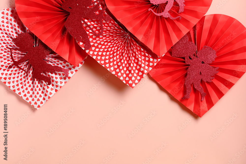Obraz premium Red paper hearts with glitter cupids and patterns on pink background.