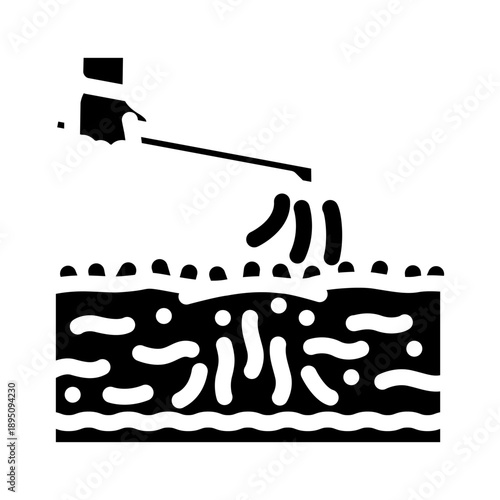 Hand holding a dispenser applying substances like pesticides or fertilizers to the soil, illustrating agricultural practices and chemical impact on cultivation