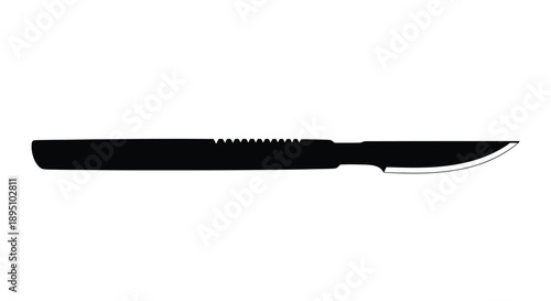 Sharp scalpel laying horizontally a dark and striking silhouette