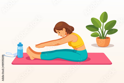 Woman exercising stretching on a yoga mat during indoor fitness workout