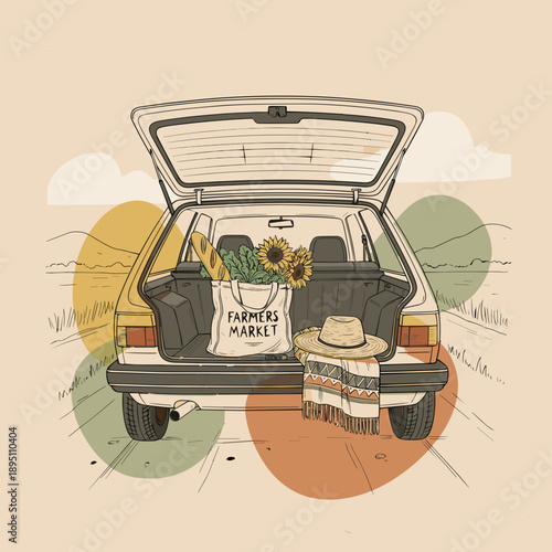 A vintage car with an open trunk carrying a reusable farmers market bag and travel essentials, on a scenic road with copy space