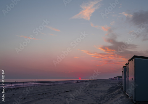 Sunset on the North Sea coast - people photographing the setting sun