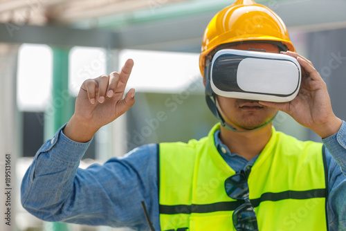 Billede på lærred Construction engineer wearing VR headset and safety gear explores virtual simulation for industrial training and site planning