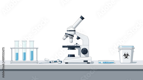Microscope, Test Tubes, and Biohazard Waste Bin on Lab Bench - Scientific Research Concept