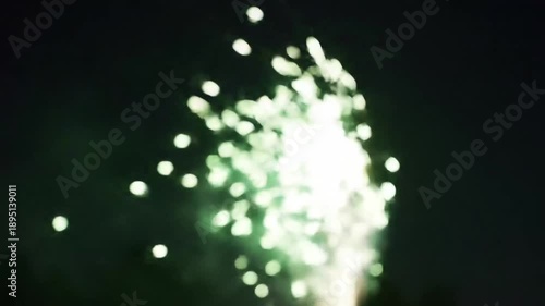Abstract bokeh fireworks display against a dark night sky