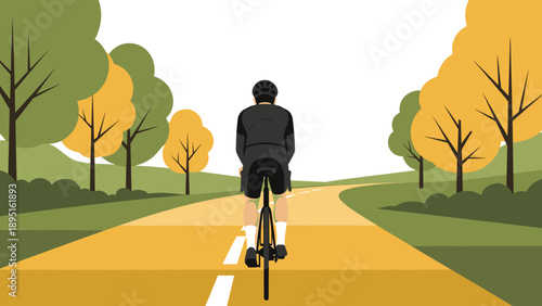 Cyclist on scenic autumn road in minimalist landscape