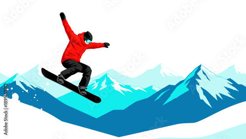 Snowboarder mid-jump on mountainous winter landscape with blue peaks