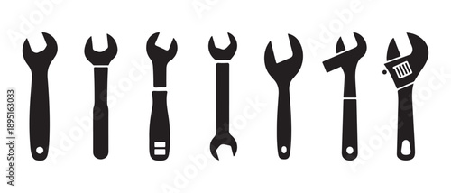 Collection of various black wrench and spanner silhouettes, essential tools for repair, mechanic, and maintenance work.