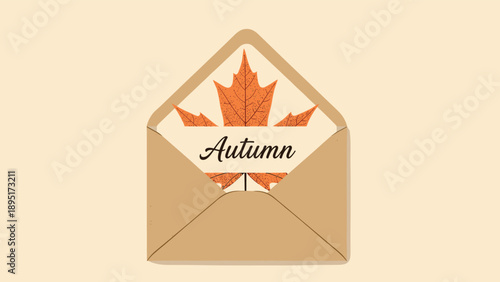 Kraft paper envelope opened to reveal a large orange maple leaf with the word Autumn printed on it representing the arrival of the fall season.