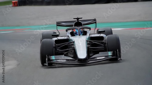 Black Formula One car on the circuit, red and white curb fast racing vehicle	