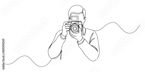 Continuous one line of a photographer holding a vintage camera, symbolizing creativity and capturing moments, drawn vector illustration.