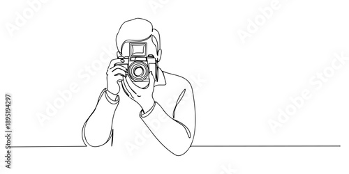 Continuous one line of a photographer holding a vintage camera, symbolizing creativity and capturing moments, drawn vector illustration.