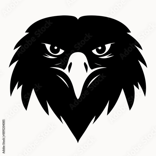 A black silhouette of an eagles head with intense gaze