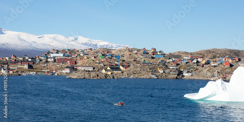 The Town Of Uummannaq, Greenland, September 2025: Houses And Apartments Along The Shore And Up the Hills Of The Uummannaq Island in the Uummannaq Fjord.