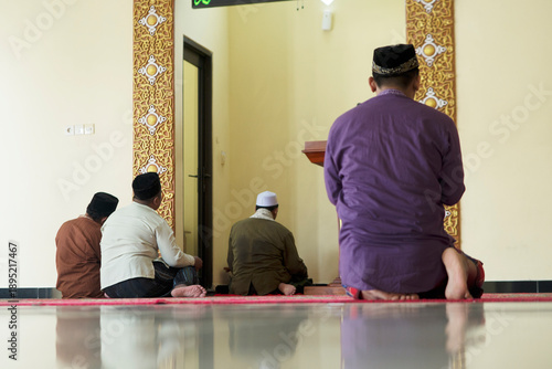 Communal Prayer Scene with Ornate Mosque Interior