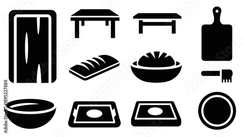 Silhouette kitchen utensils collection: cutting boards, tables, and bread in bold black design