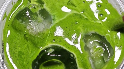 Smooth iced matcha latte. Close up.