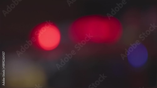 Motion blur of emergency siren lights during a night patrol or high-speed chase
