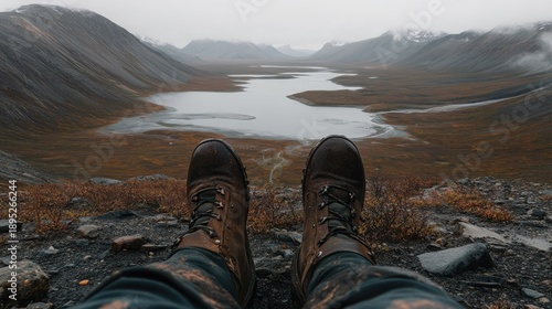 Hiking Boots Overlooking Mountain Valley Lake: Perspective, Adventure, Serenity, Nature's Beauty.