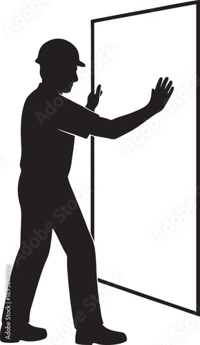 Worker installing glass silhouette