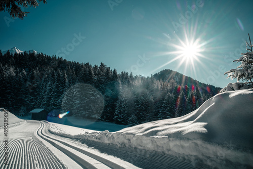 Tableau sur toile Sunny winter landscape with cross-country ski trail in the Tyrolean Alps