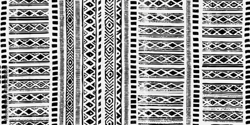 Black and white geometric pattern with repeating vertical stripes and shapes