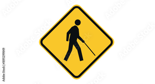 A visually impaired person walking with a cane on a road sign