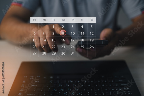 Photos Person selecting date on digital calendar interface via mobile device, representing time management, task scheduling, productivity planning, business organization, and modern digital workflow